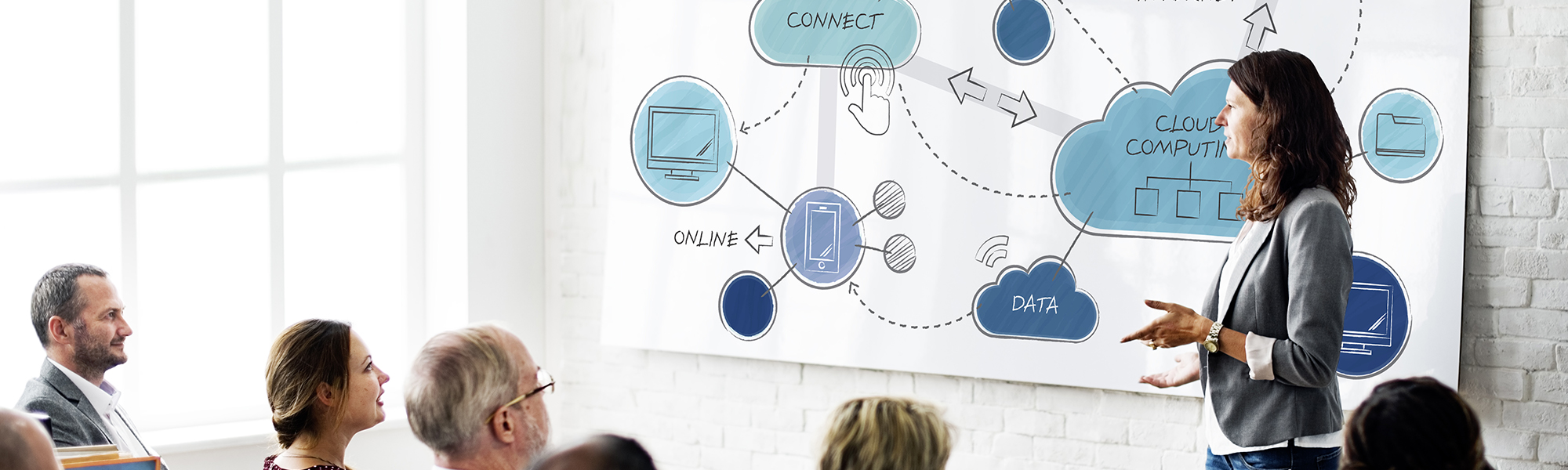 Woman presenting with presentation showing connecting icons