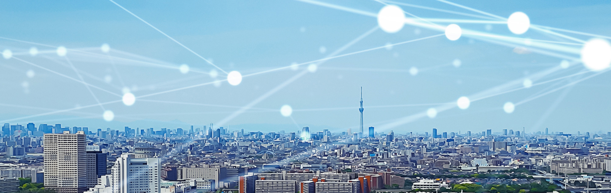 Image of black city buildings from birds eye view with neon blue tech lines running through